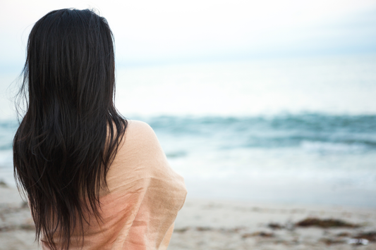 woman looking out into the ocean